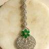 Rhodium-plated floral maang tikka with AD stones in a silver and green from Inaury