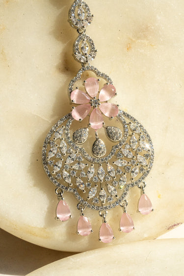 Rhodium-plated floral maang tikka with AD stones in a silver and pink finish from Inaury