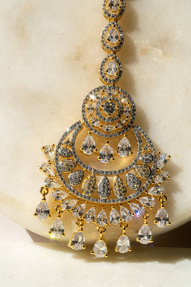 Close Up of Gold-Plated Multicolor AD Maang Tikka with Light Pink and White Stones