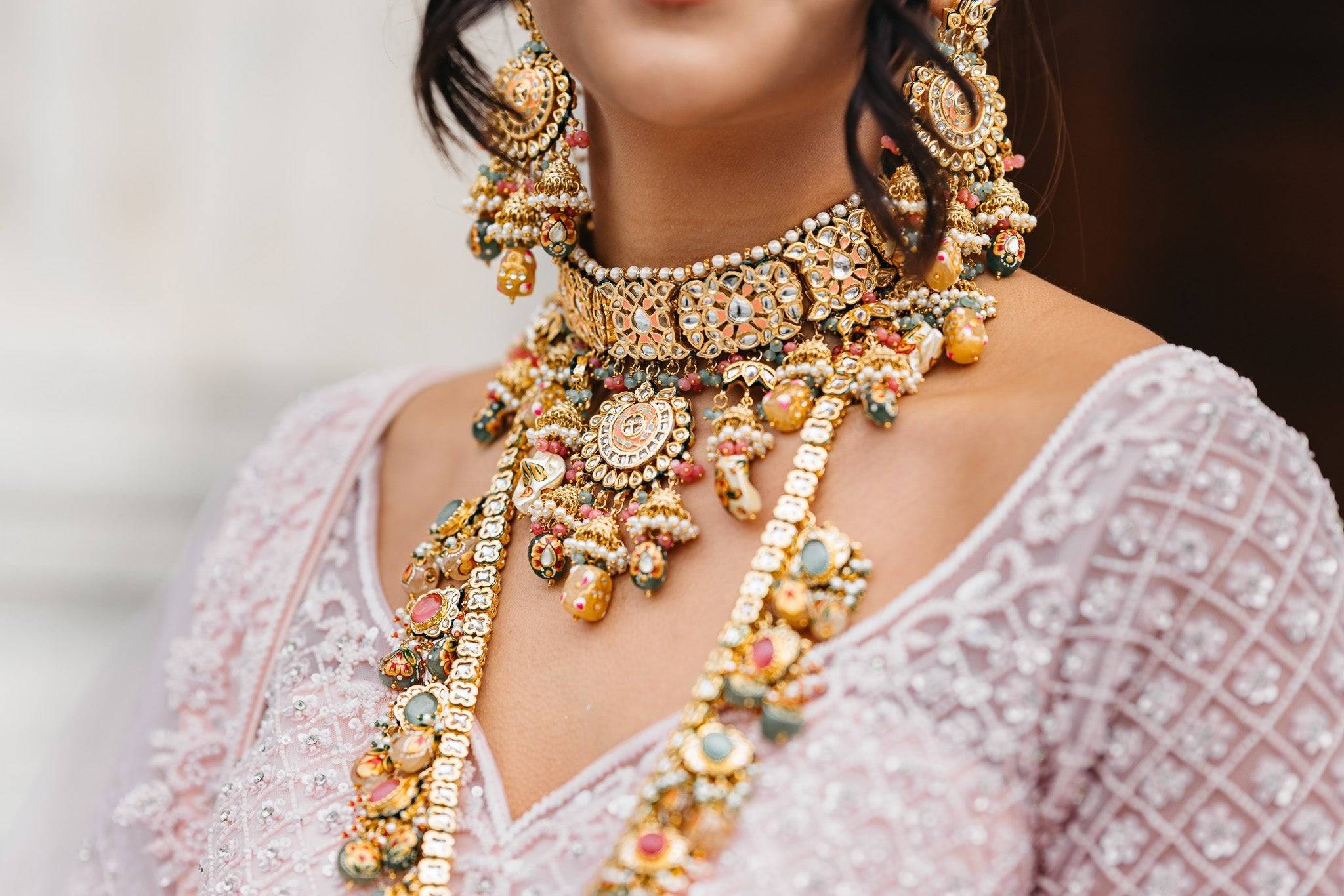 Arthi Bridal Set - Gold-plated with Polki, Kundan, and Meenakari work, featuring an oversized choker necklace, layered long necklace, matching earrings, and Maang Tikka.
