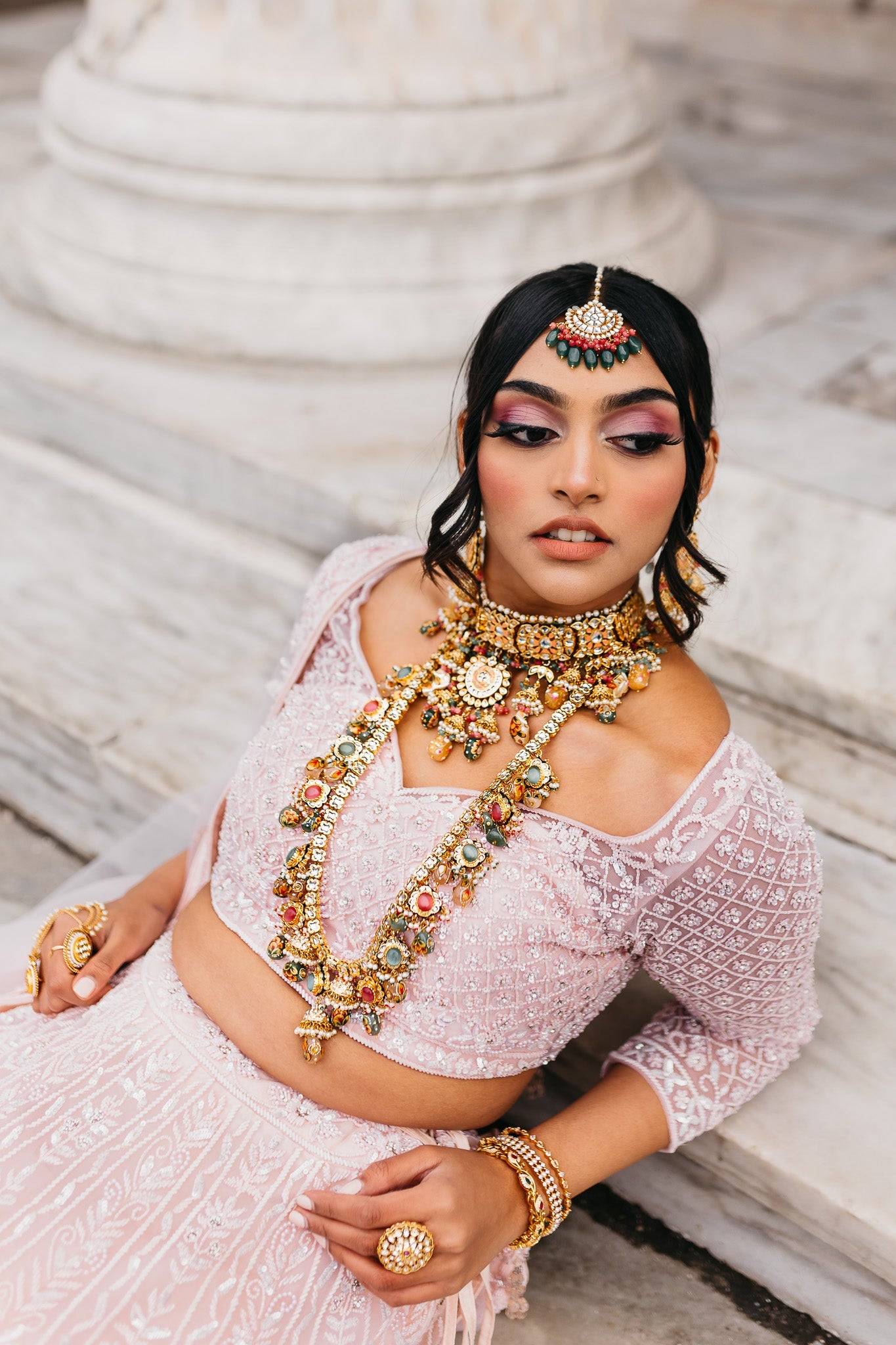 Arthi Bridal Set - Gold-plated with Polki, Kundan, and Meenakari work, featuring an oversized choker necklace, layered long necklace, matching earrings, and Maang Tikka.