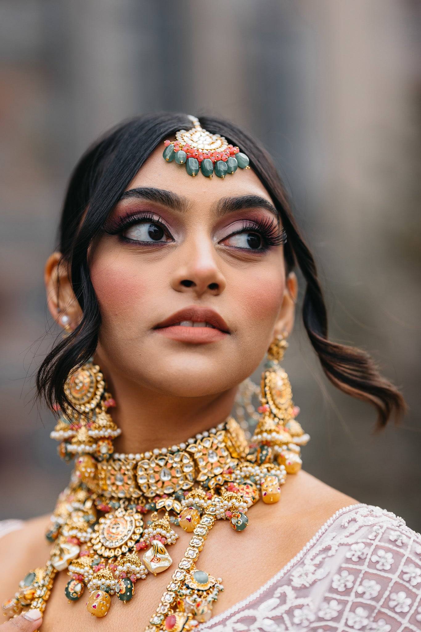 Arthi Bridal Set - Gold-plated with Polki, Kundan, and Meenakari work, featuring an oversized choker necklace, layered long necklace, matching earrings, and Maang Tikka.