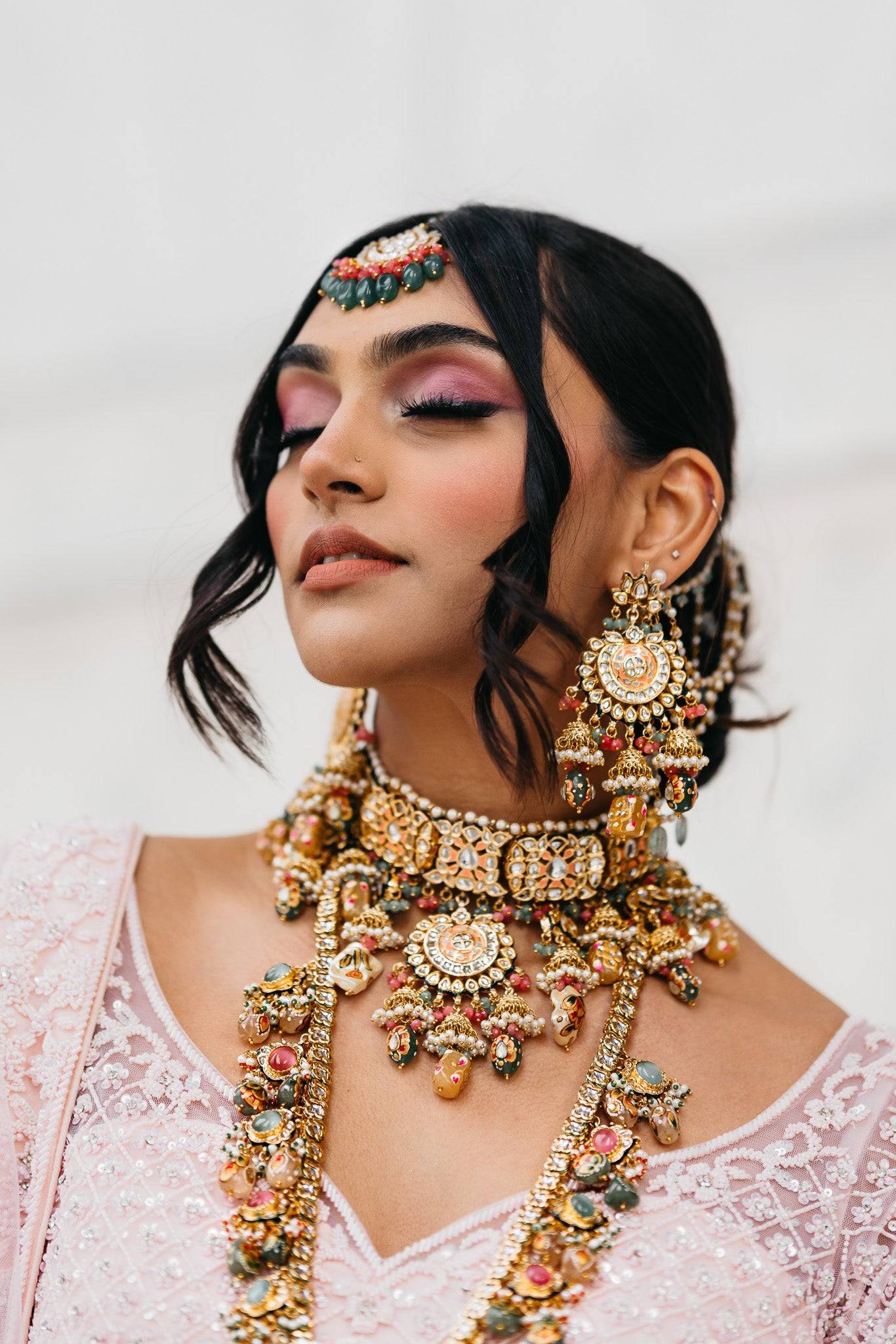Arthi Bridal Set - Gold-plated with Polki, Kundan, and Meenakari work, featuring an oversized choker necklace, layered long necklace, matching earrings, and Maang Tikka.