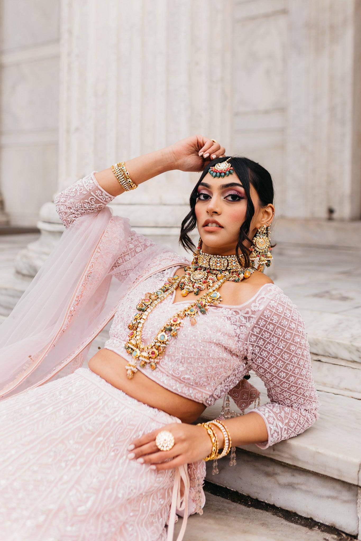 Arthi Bridal Set - Gold-plated with Polki, Kundan, and Meenakari work, featuring an oversized choker necklace, layered long necklace, matching earrings, and Maang Tikka.