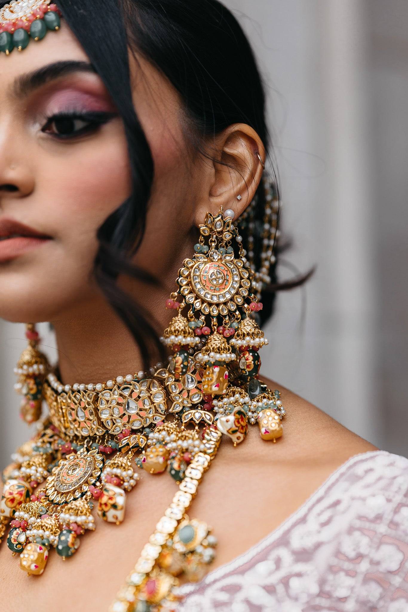 Arthi Bridal Set - Gold-plated with Polki, Kundan, and Meenakari work, featuring an oversized choker necklace, layered long necklace, matching earrings, and Maang Tikka.