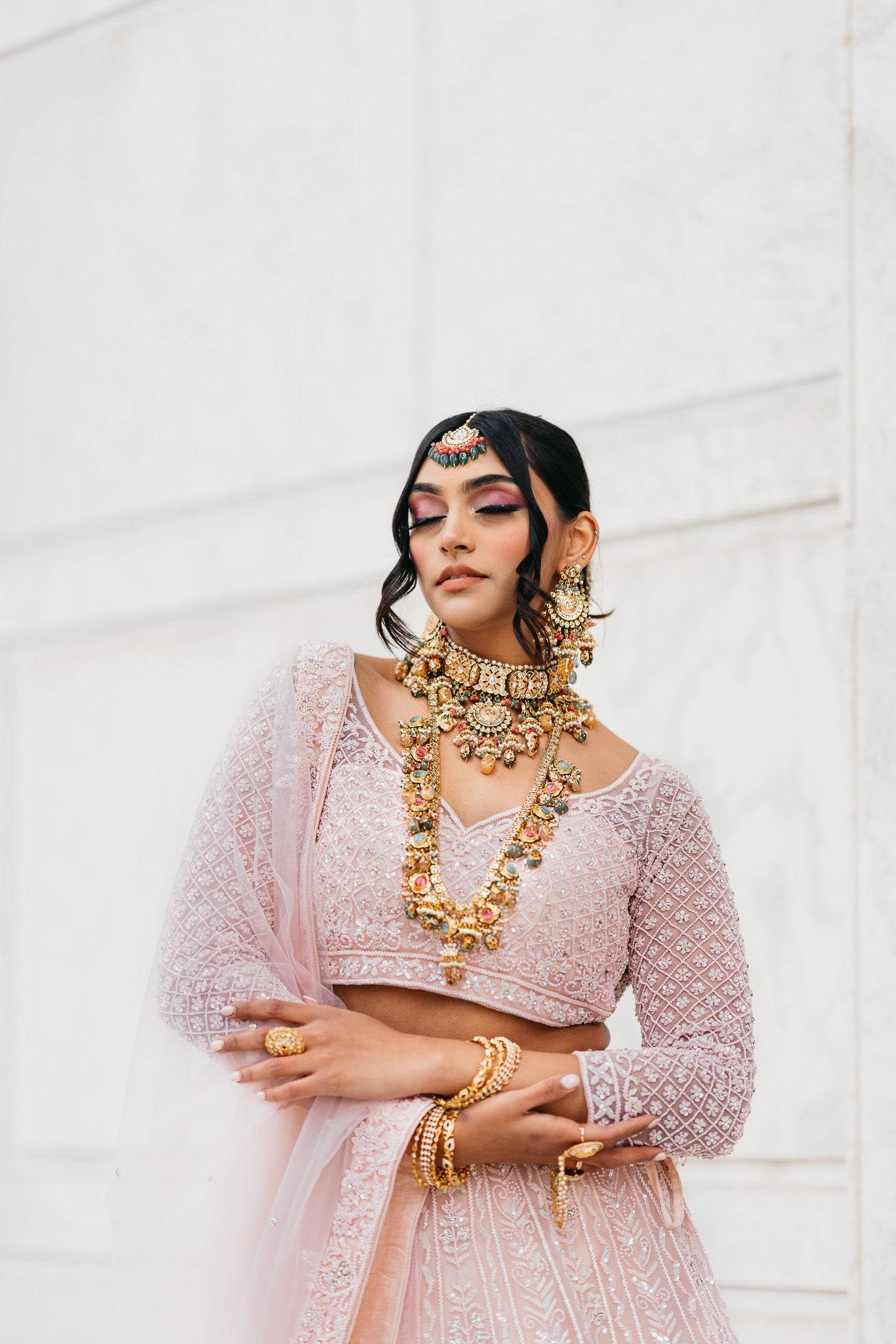 Arthi Bridal Set - Gold-plated with Polki, Kundan, and Meenakari work, featuring an oversized choker necklace, layered long necklace, matching earrings, and Maang Tikka.