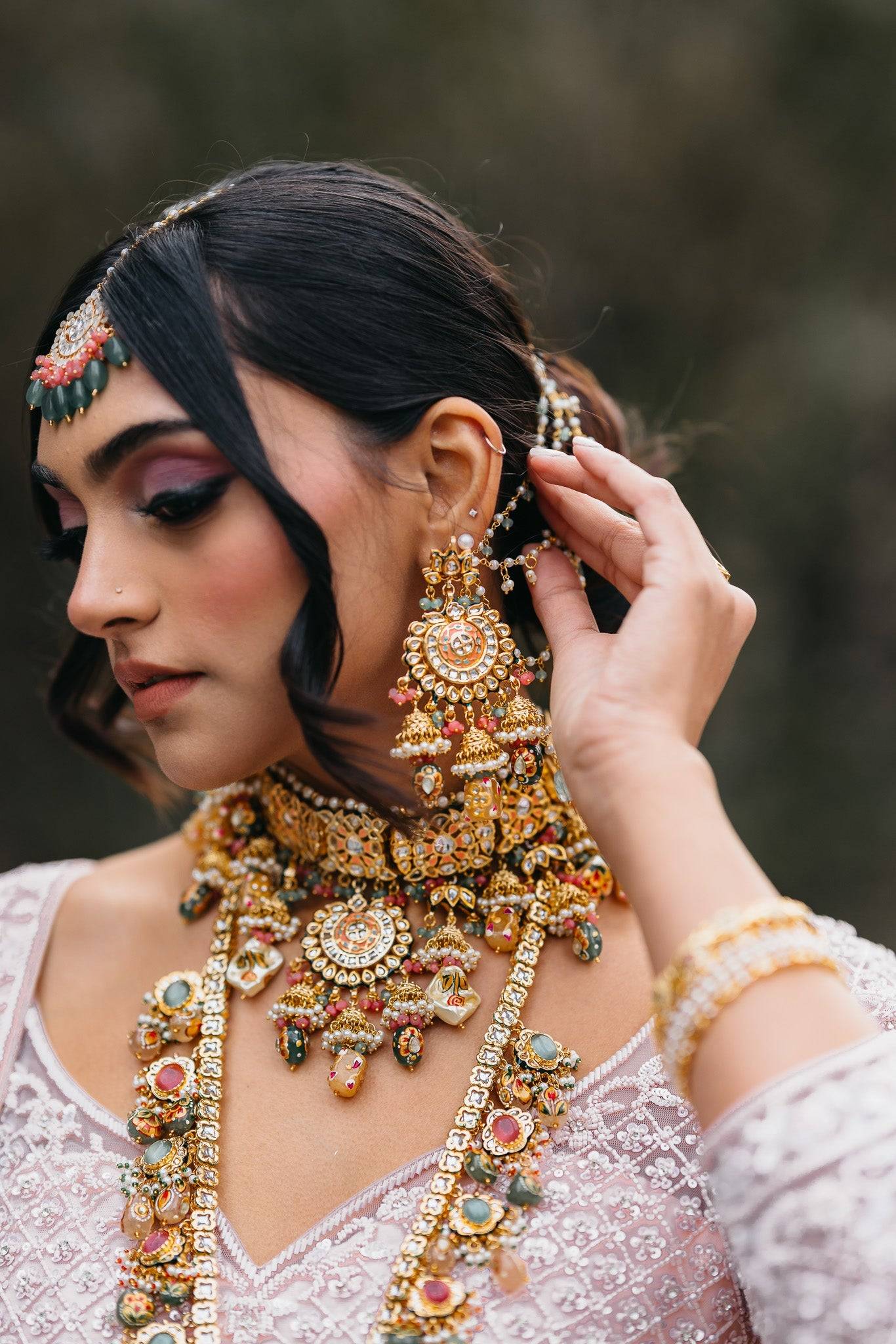 Arthi Bridal Set - Gold-plated with Polki, Kundan, and Meenakari work, featuring an oversized choker necklace, layered long necklace, matching earrings, and Maang Tikka.