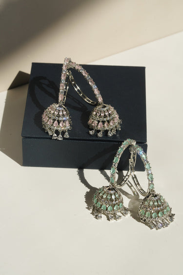 Disha AD hoop jhumka earrings blush pink and mint green styled on jewellery box South Asian festive statement earrings