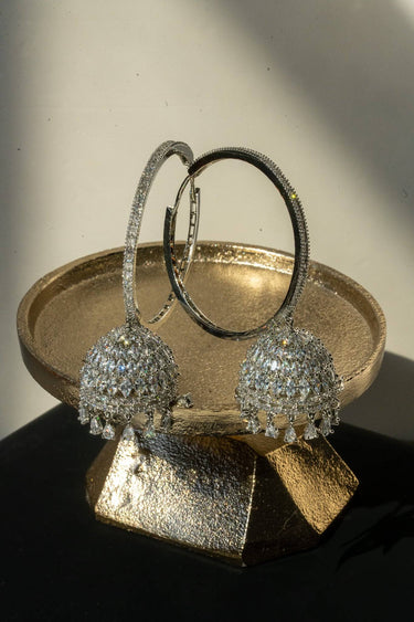 Gina Diamante Long Hoop Jhumka Earrings on black surface