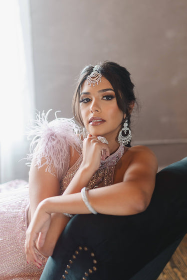 Iliyana Maang Tikka in rhodium finish with CZ stones, featuring a floral crescent design. Ideal for bridal and festive hair styling by Inaury.