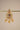A close up studio catalog shot focusing on a single Aadhya Kundan drop earring hanging on a display bar to highlight the fine seed pearl trim.