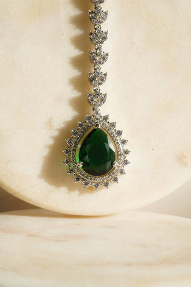 Close-up of Amore AD Maang Tikka featuring green teardrop stone