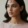 Amore American Diamond Maang Tikka in light pink worn by a female model showing a modern South Asian wedding guest hairstyle.