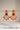 A clean studio catalog display showcasing the all-ruby red colorway variant of the Kavya traditional gold-plated crescent statement earrings.