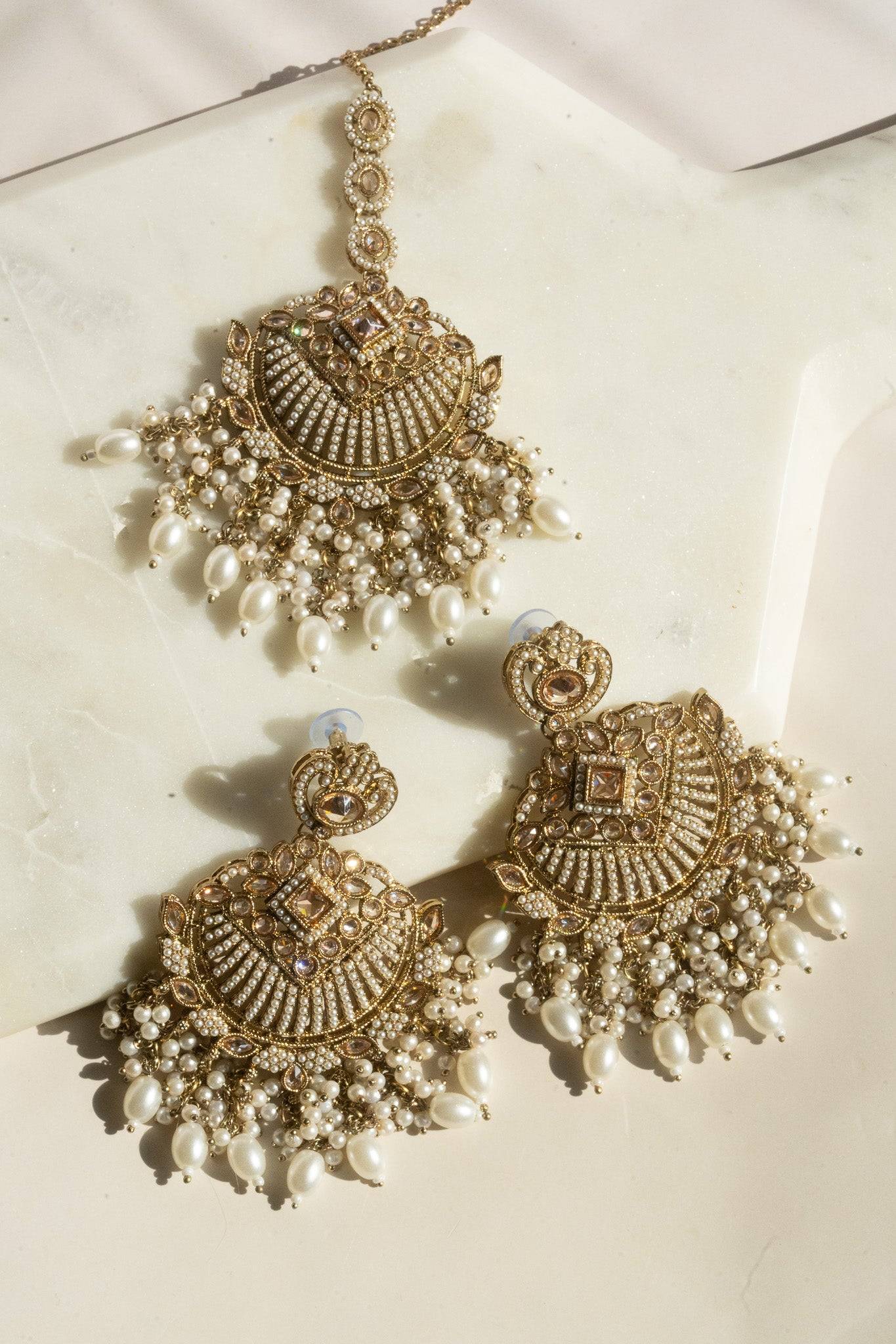 Statement mehendi gold chandbali earrings and tikka set with pearl drops