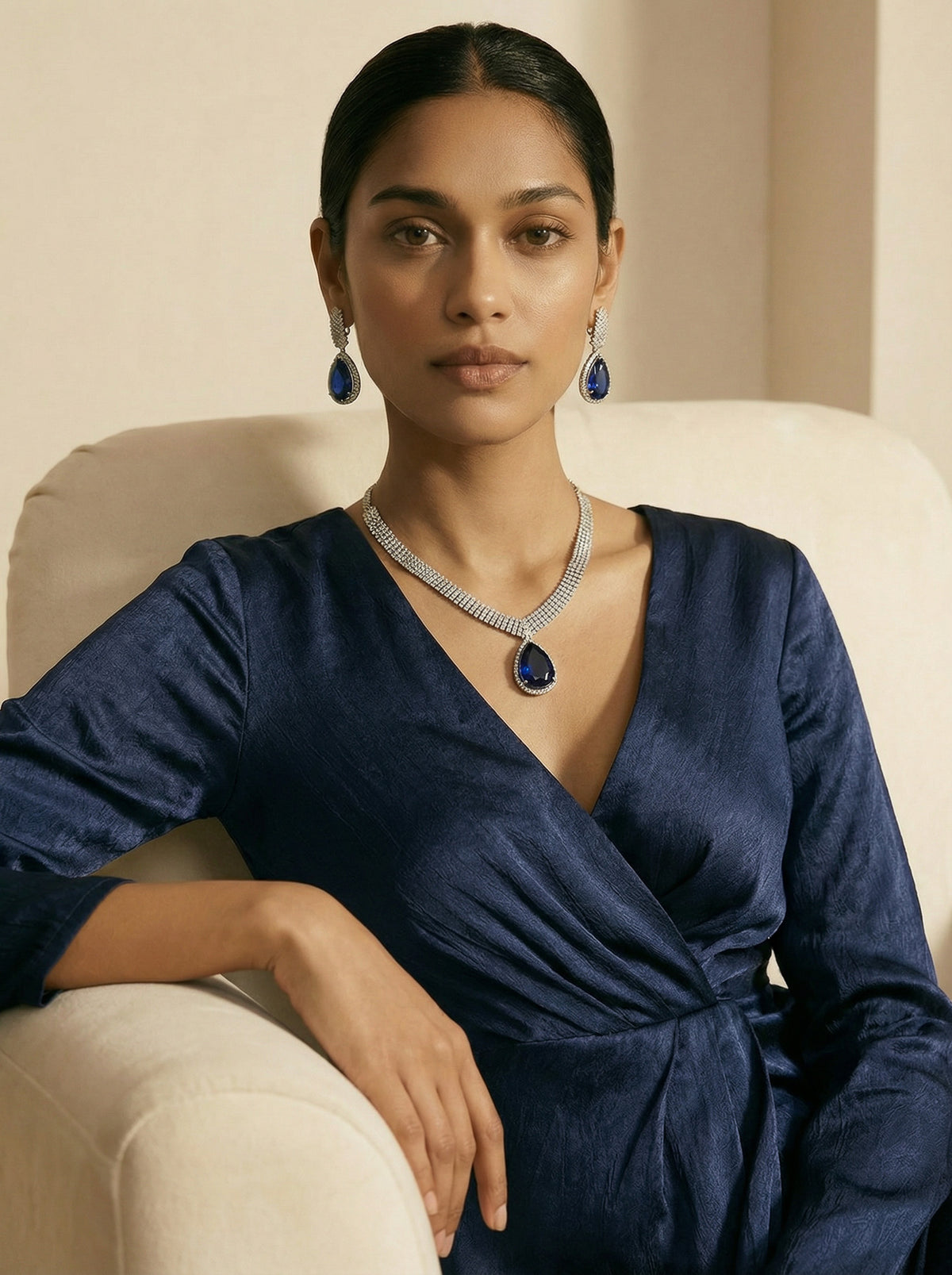 Close-up of Inaury sapphire teardrop necklace with diamond collar and matching earrings - handcrafted South Asian jewelry for modern diaspora