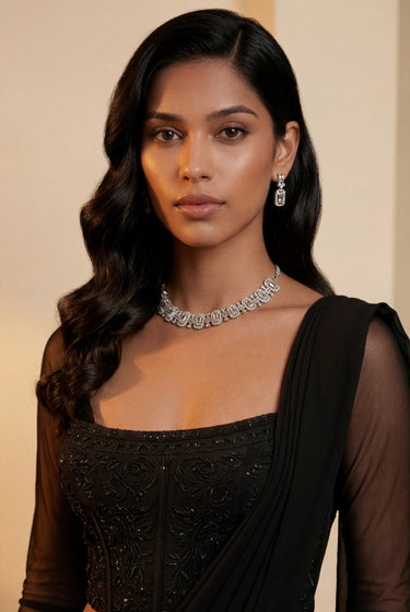 An extreme close-up look highlighting the flawless neck-hugging fit and bright stone setting of the rhodium-plated Shanaya baguette choker set on a model.