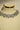 Alternative studio presentation angle of the Shanaya geometric silver-toned choker and earring set positioned under specialized jewelry lighting.