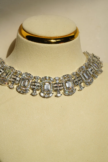 Alternative studio presentation angle of the Shanaya geometric silver-toned choker and earring set positioned under specialized jewelry lighting.