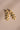 Four-tier Kundan drop earrings with round stones, gold-plated settings and cream pearl clusters.