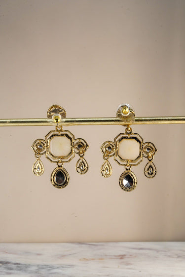 A clean studio view of the reverse side of the Zoe statement earrings displaying the quality of the solid mehndi gold plated backing and post closure.