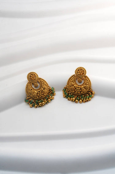 Inaury Gurleen Gold Chandbali Earrings pair flat lay — both earrings showing full crescent silhouette with granulated gold body and emerald green bead drops