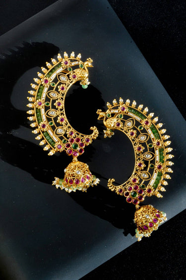 Inaury Maharani Ear Cuffs with Jhumka in Ruby Emerald — gold-plated crescent ear cuffs with ruby-pink and emerald stones, peacock motif, and jade bead jhumka drop