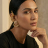 Inaury Tripthi Ear Climbers in Pearl White — gold-plated kundan peacock ear climber with pearl drops styled with black top
