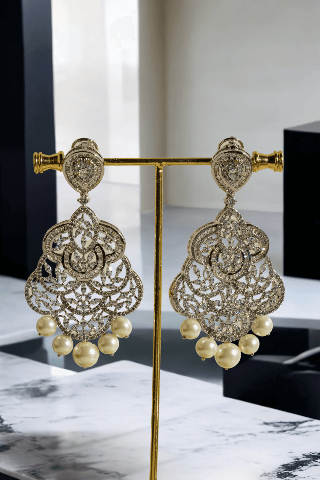 Irene Radiant Pearl Drop Earrings, rhodium-plated with intricate filigree design, pavé white stones, and pearl drops, 3.4 inches long - Indian jewelry for festive and wedding occasions.