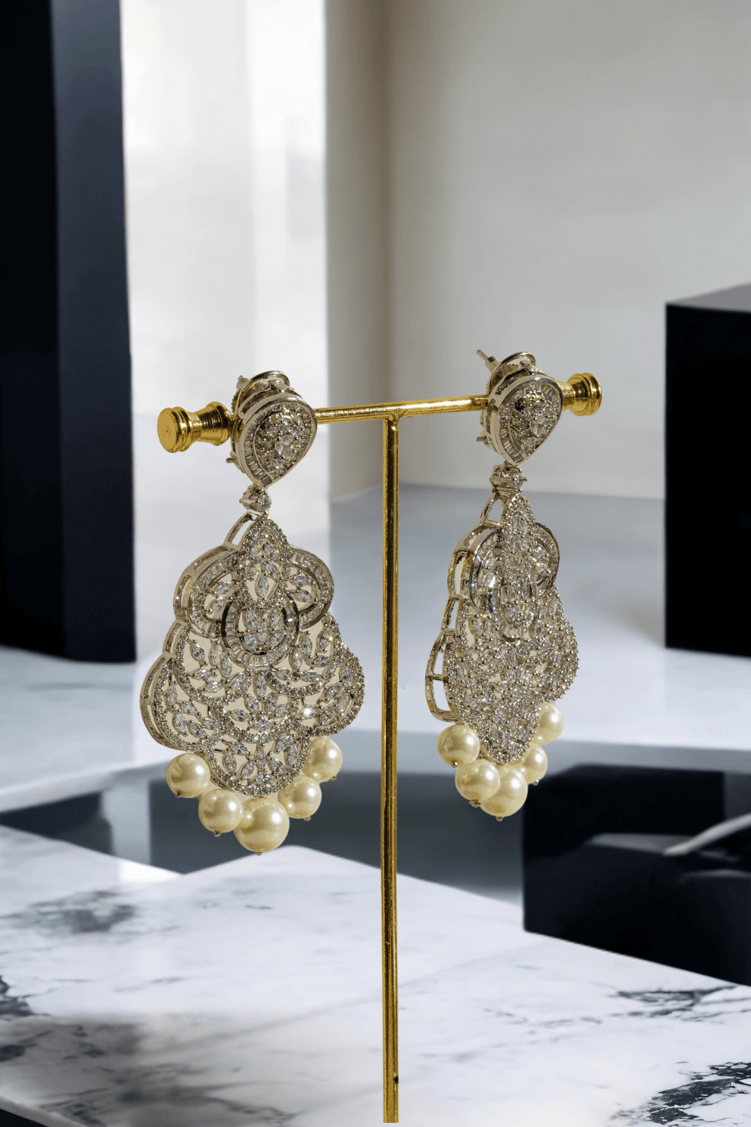 Irene Radiant Pearl Drop Earrings, rhodium-plated with intricate filigree design, pavé white stones, and pearl drops, 3.4 inches long - Indian jewelry for festive and wedding occasions.