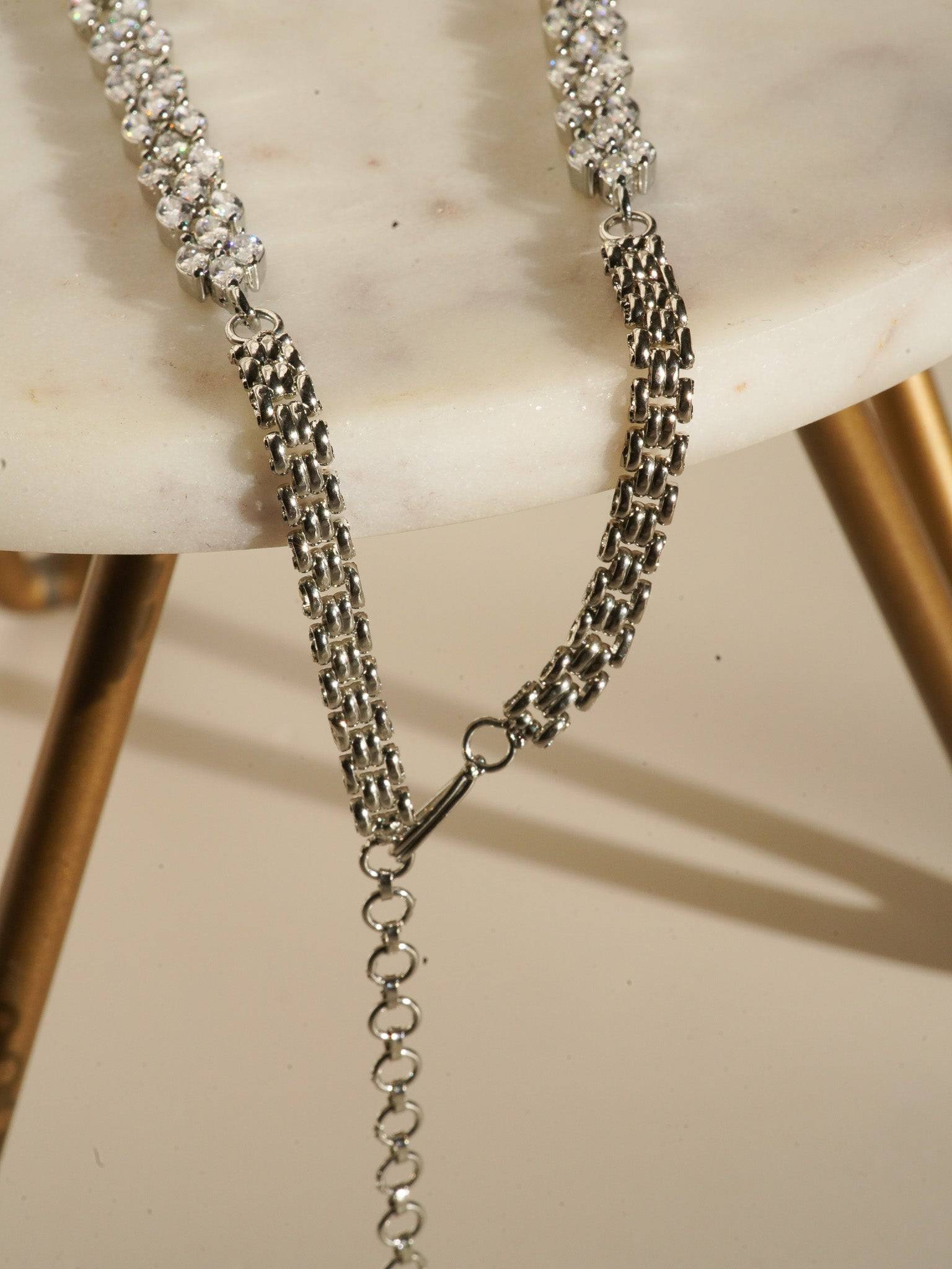 Lina Long Diamante Accent AD Necklace Set - Rhodium-plated with white AD stones, featuring intricate patterns and pendant-like centerpiece, available in silver & sapphire blue, silver & purple, and silver & citrine yellow, with matching dangling earrings.