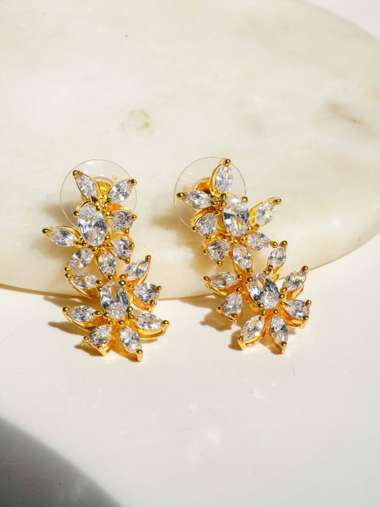 Lama Single Layer Long Diamante Accent AD Necklace Set in rhodium-plated silver or gold finish with intricate floral pattern and matching dangling earrings.