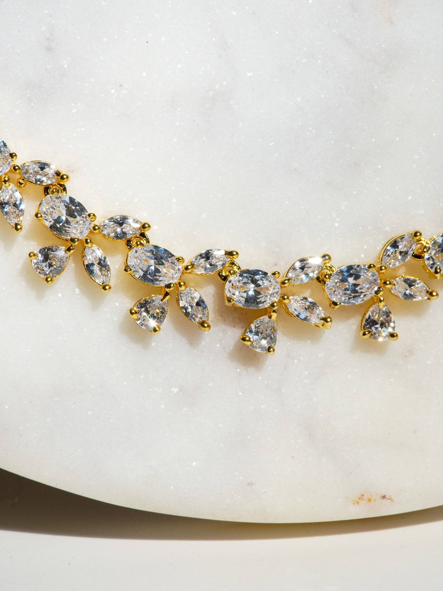 Lama Single Layer Long Diamante Accent AD Necklace Set in rhodium-plated silver or gold finish with intricate floral pattern and matching dangling earrings.