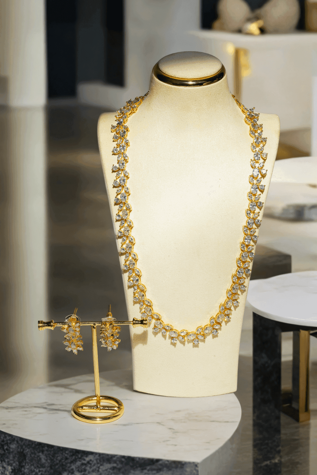 Lama Single Layer Long Diamante Accent AD Necklace Set in rhodium-plated silver or gold finish with intricate floral pattern and matching dangling earrings.