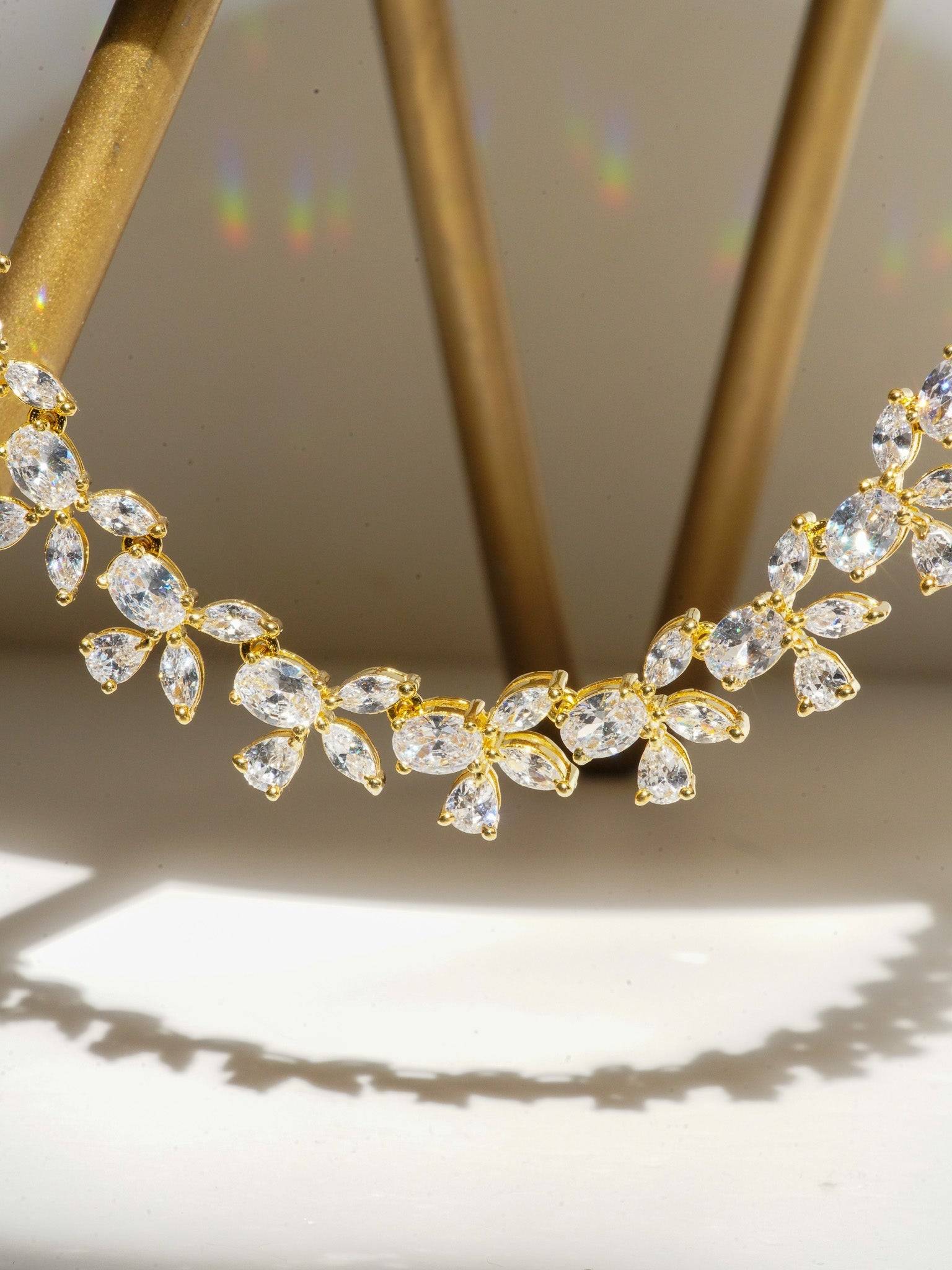 Lama Single Layer Long Diamante Accent AD Necklace Set in rhodium-plated silver or gold finish with intricate floral pattern and matching dangling earrings.
