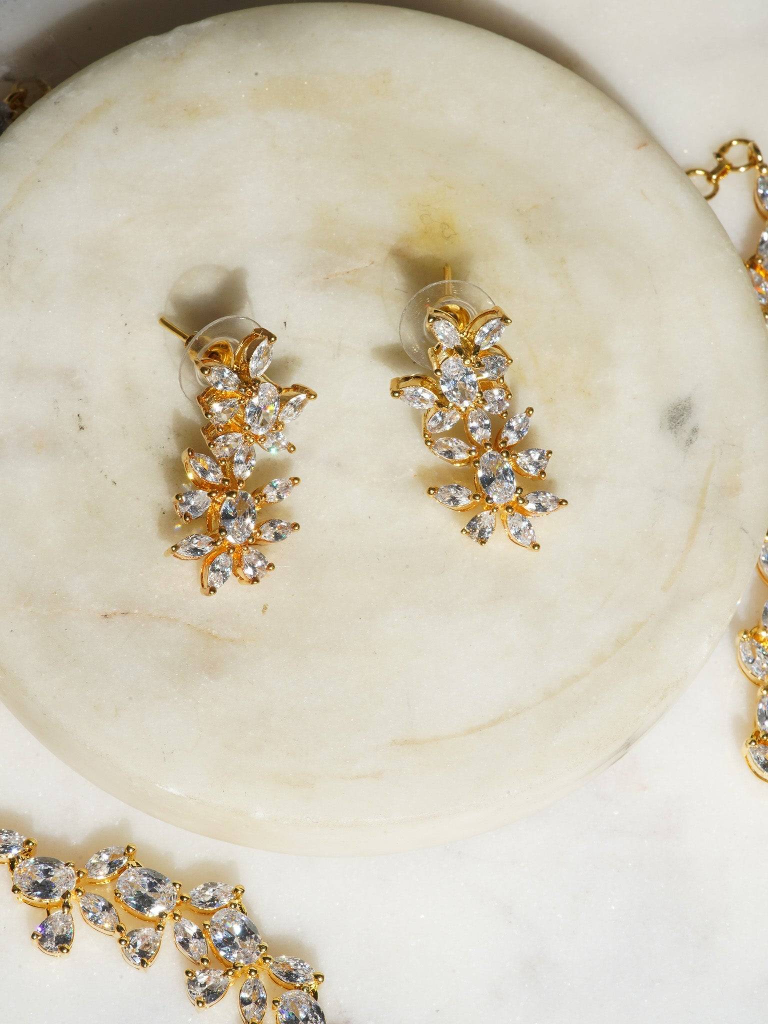 Lama Single Layer Long Diamante Accent AD Necklace Set in rhodium-plated silver or gold finish with intricate floral pattern and matching dangling earrings.
