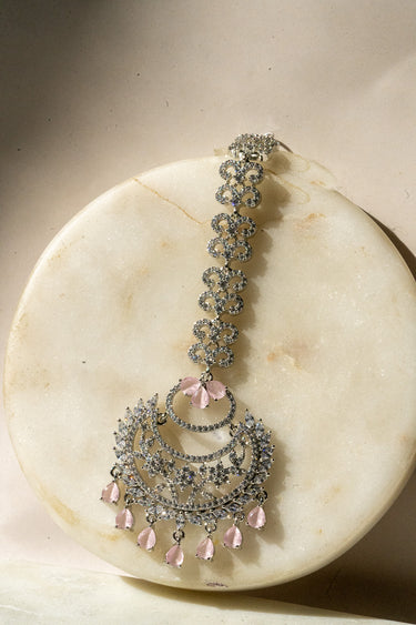 Full view of Liza Rhodium-Plated AD Maang Tikka in pink, featuring ornate craftsmanship and shimmering accents.