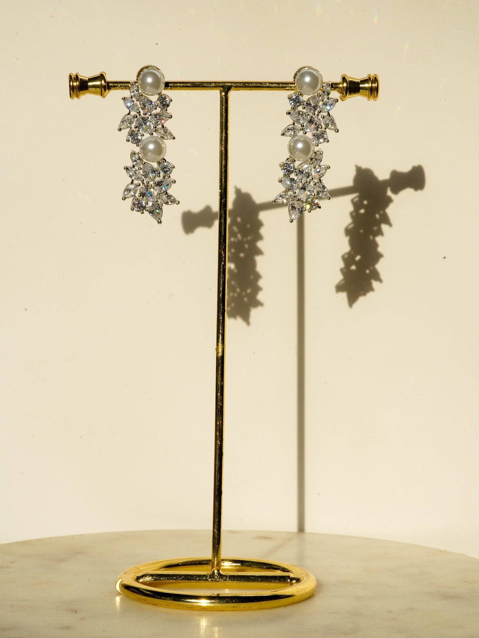 Mukta Diamante Accent AD Necklace Set - Rhodium or rose gold-plated finish, adorned with AD stones and faux pearls, featuring intricate floral patterns and matching minimal earrings.