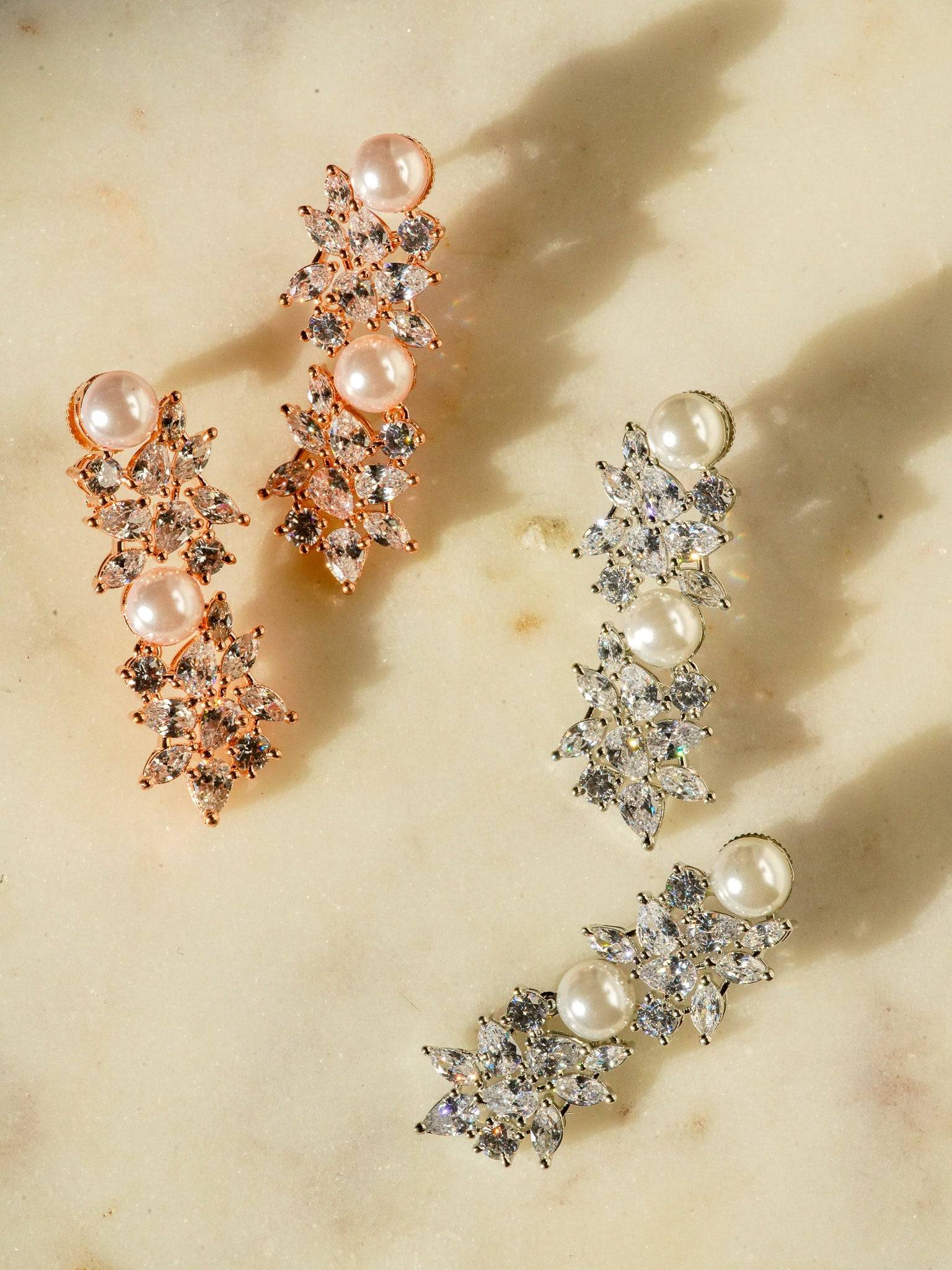 Mukta Diamante Accent AD Necklace Set - Rhodium or rose gold-plated finish, adorned with AD stones and faux pearls, featuring intricate floral patterns and matching minimal earrings.