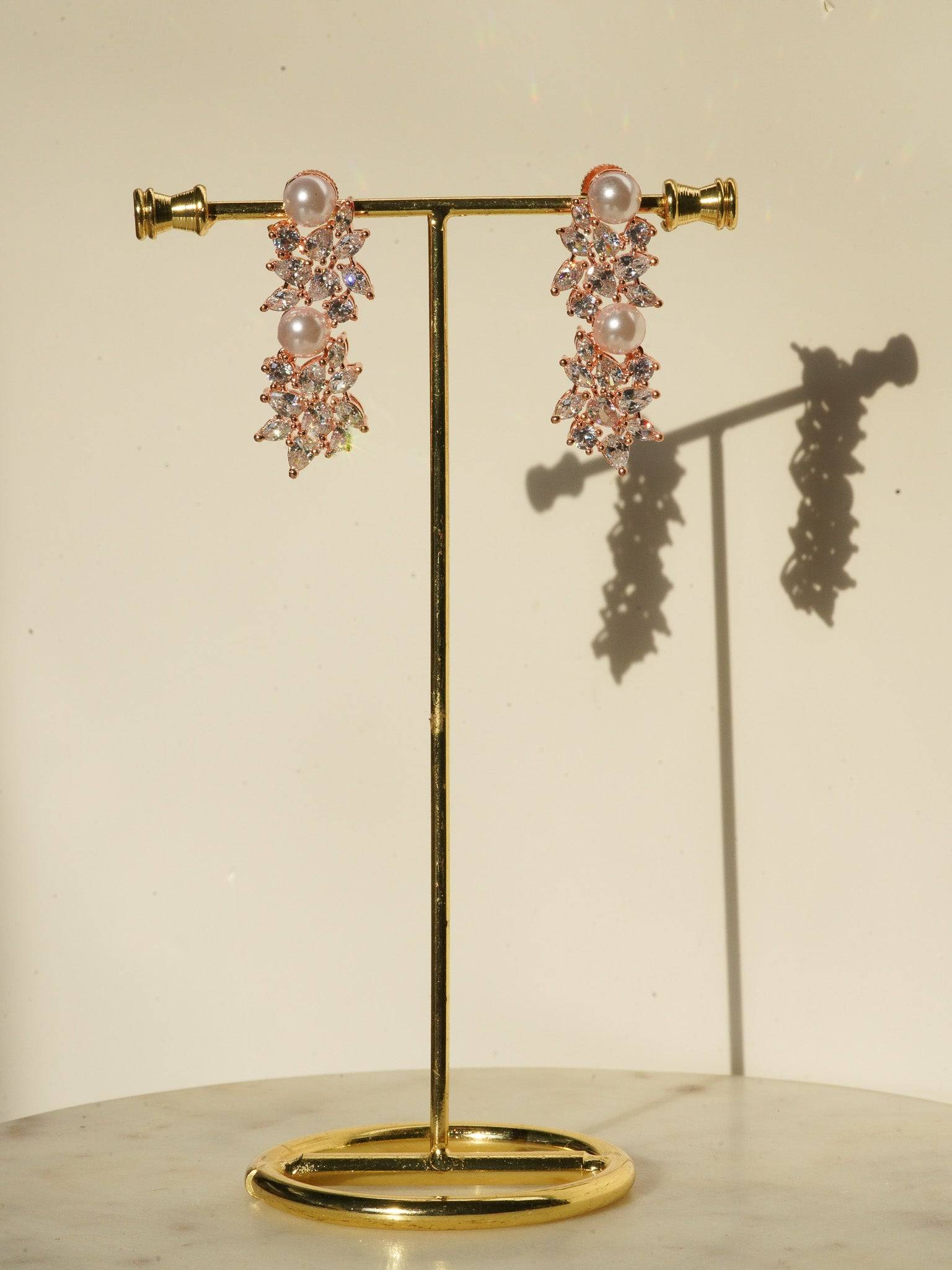 Mukta Diamante Accent AD Necklace Set - Rhodium or rose gold-plated finish, adorned with AD stones and faux pearls, featuring intricate floral patterns and matching minimal earrings.