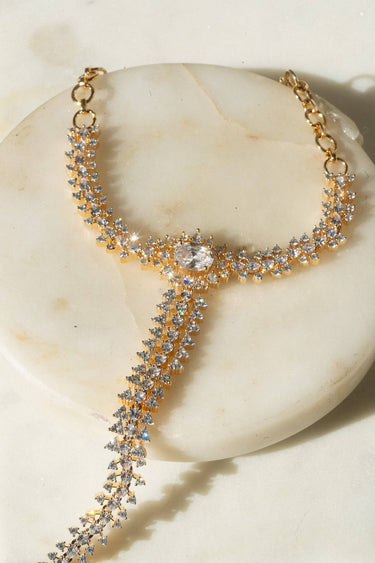 Nayla statement haathphool - hand chain bracelet in gold with ring