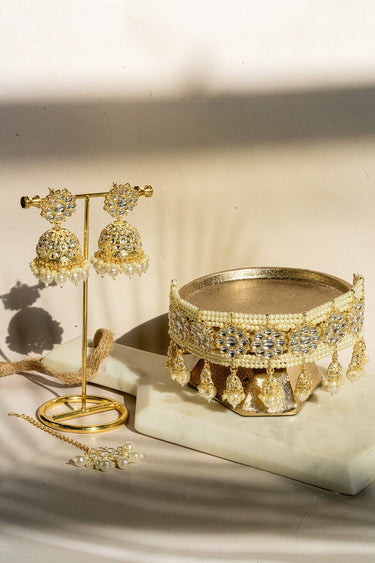 Neeshy champagne gold plated choker necklace set with resin bead detailing , paired with jhumka earrings and maang tikka from Inaury
