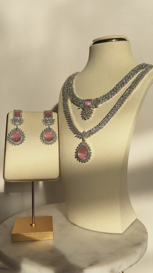 Amore Double Layer AD Necklace Set - Rhodium-plated with sparkling AD stones, available in sapphire blue or pink, featuring matching earrings and a double-layered design.