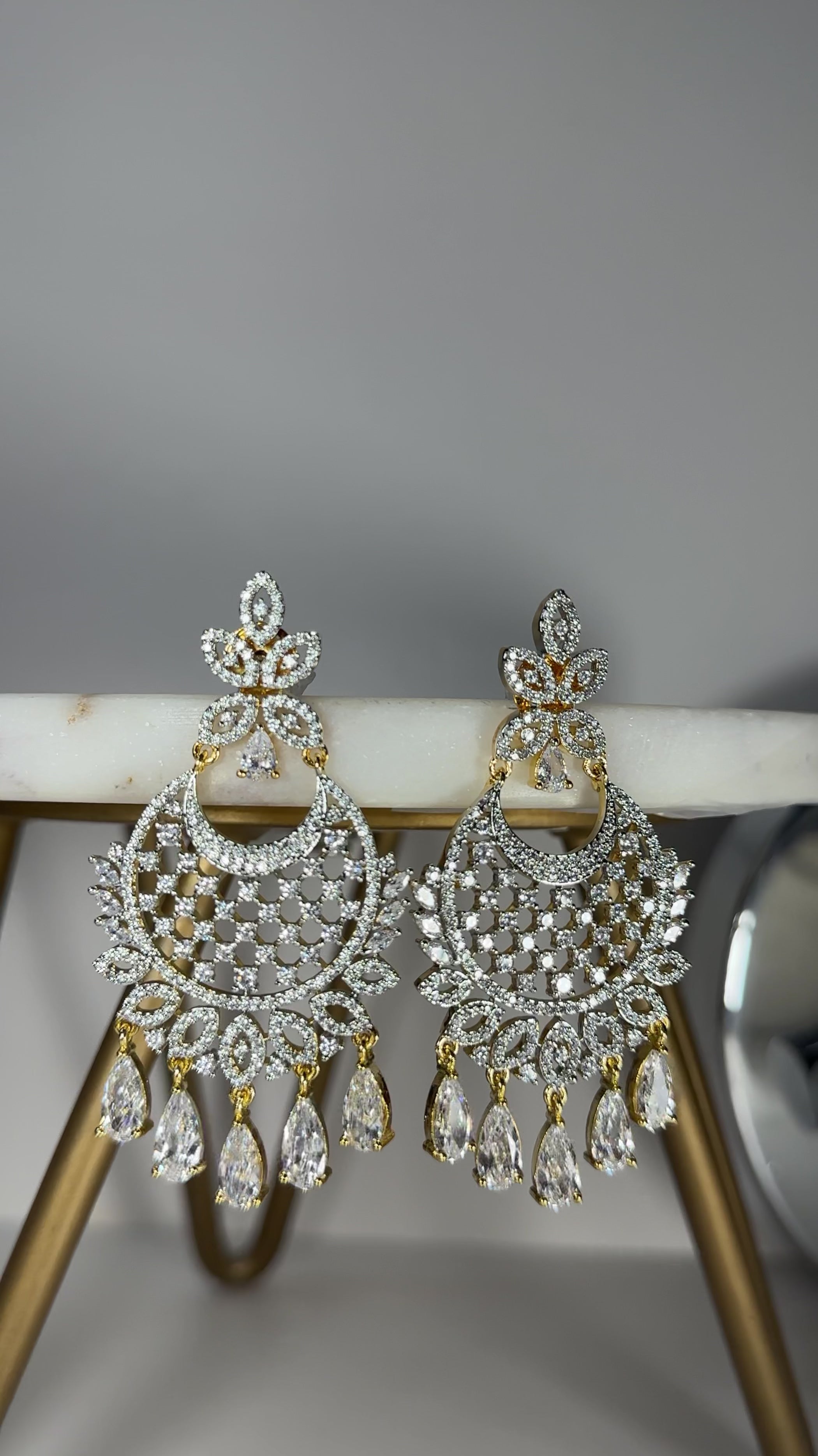 Siya AD Chandbali Earrings - Available in rhodium or gold plating with white AD stones, featuring a 2.5-inch drop, perfect for a statement piece.