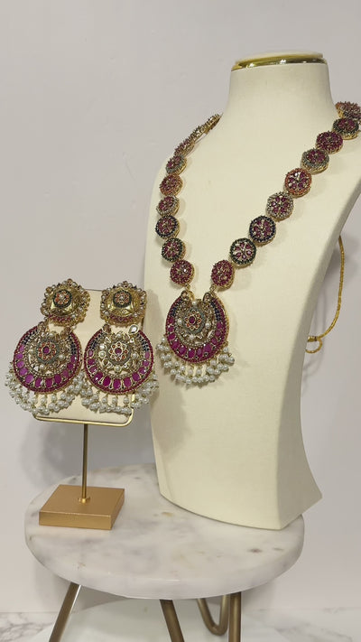 Adiva Necklace Set - Gold Mala featuring intricate stonework and pearls, showcased on a mannequin with coordinating earrings.
