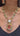 Monika Semi-Precious Gold Plated Mala Necklace Set - Multi-color stones with faux pearls and Moissanite Polki detailing, available with hot pink, light pink, or green center stones, and matching 2.6-inch statement earrings.