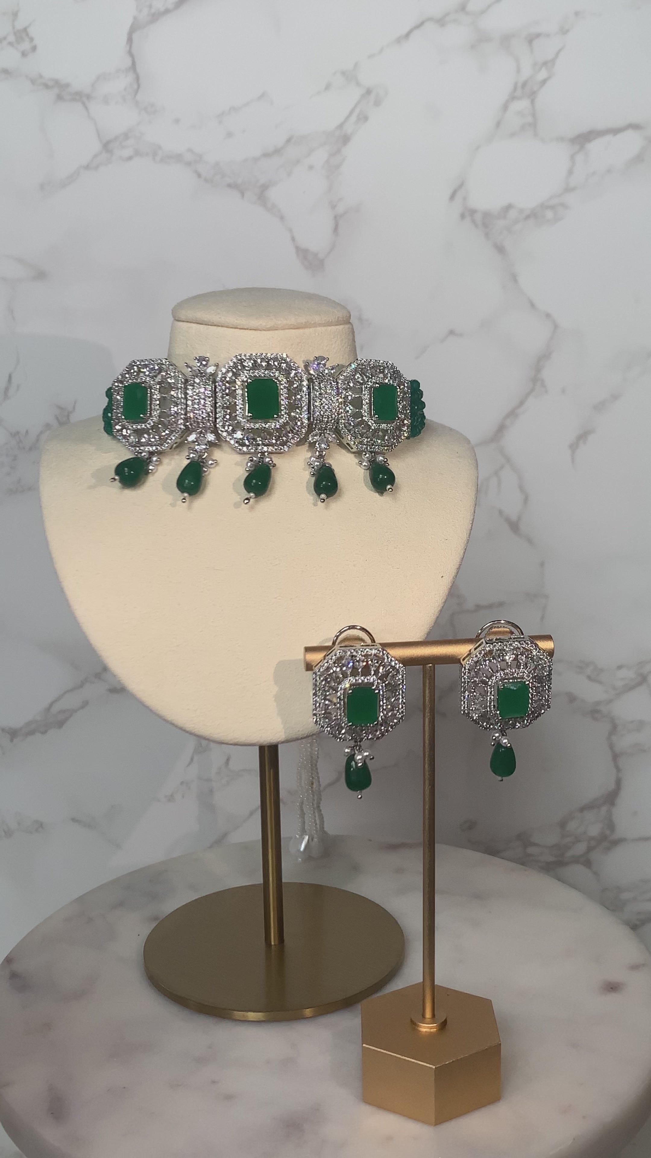Jhanvi Choker Necklace Set - Silver & Gem Variations featuring cushion-cut AD stones with green teardrop accents, includes matching earrings.