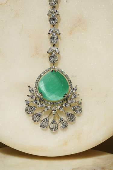 Rina Silver Maang Tikka featuring green stone and sparkling details