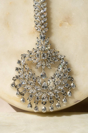 Reema rhodium CZ maang tikka with floral crystal layout from Inaury