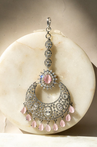 Rhodium-plated silver and pink maang tikka with American Diamond stones in pink, ruby, mint green, and white from Inaury